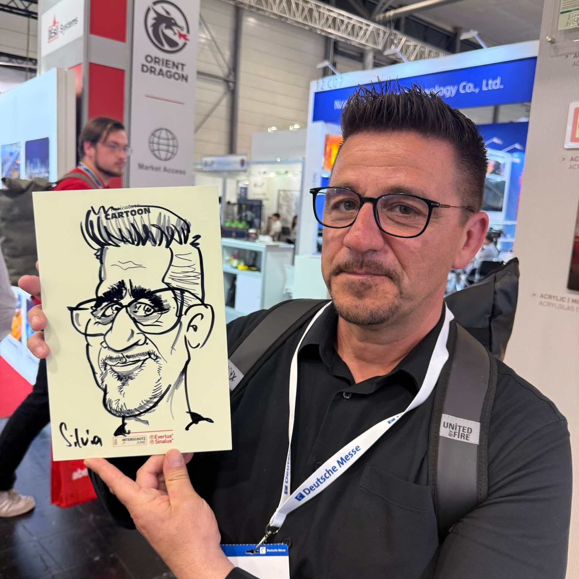 Karikaturen von Schnellzeichnerin Silvia auf der INTERSCHUTZ